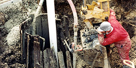 Flowing Drilled Well in Wooden Dug Well